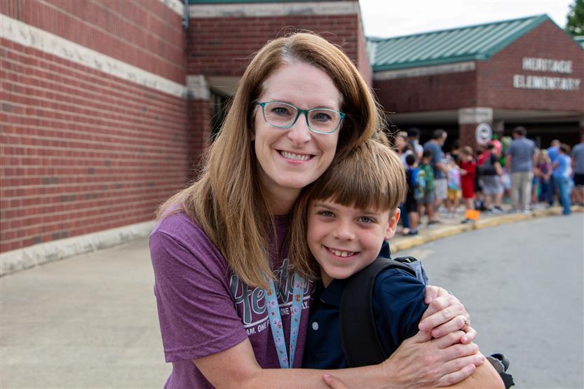 A student smiles